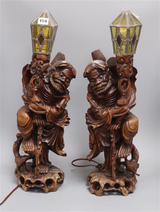 A pair of Chinese carved wood figure lamps overall height 60cm